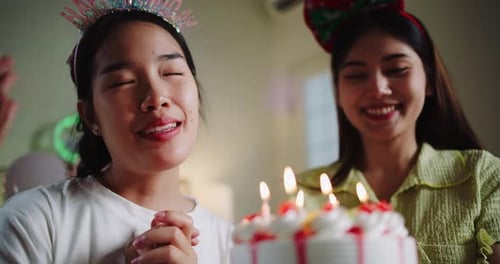 Happy Woman Blows Out Birthday Cake Candles