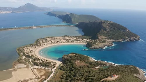 Voidokilia Beach With Semicircular Strip Of Sand Dunes In Messinia, Greece. aerial
