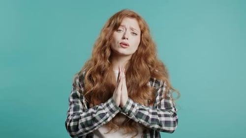 Woman with Long Hair Pleading with Hands Clasped