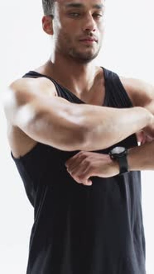 Muscular Man with Arms Crossed Posing