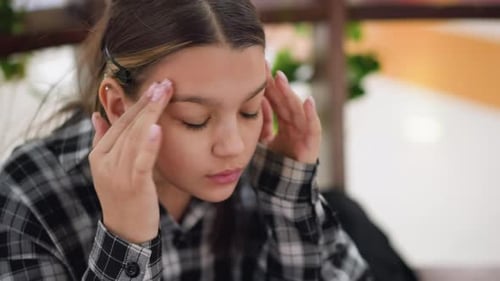 Young Woman Massaging Face for Skin Care