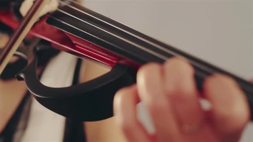 Woman Playing Electric Violin, Close Up on Hand