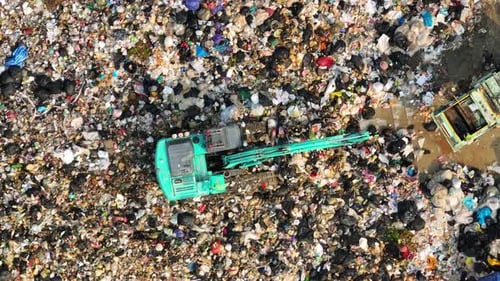 An aerial view over a landfill. 4K.