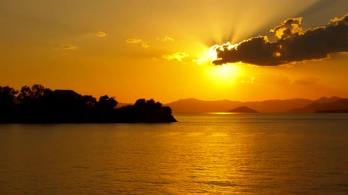 Orange Sun Over Lake Surface During Sunset