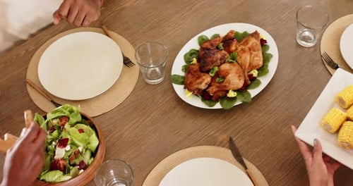 Overhead View of Roast Chicken Dinner with Family