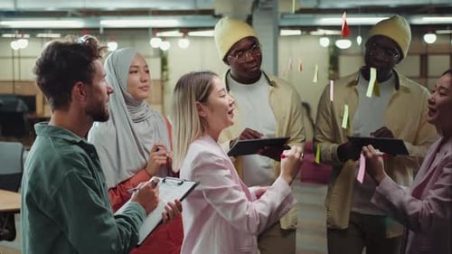 Diverse Team Brainstorming Ideas in a Modern Office