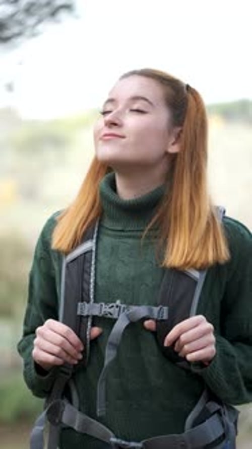 Backpacker Woman in the Mountain Breathing Fresh Air