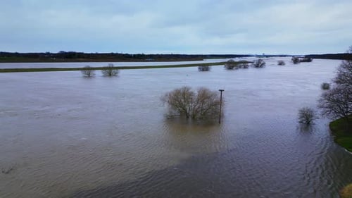 Flooded River Overrun with Brown Waters