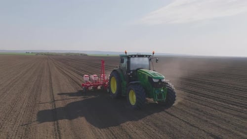 Tractor cultivating field