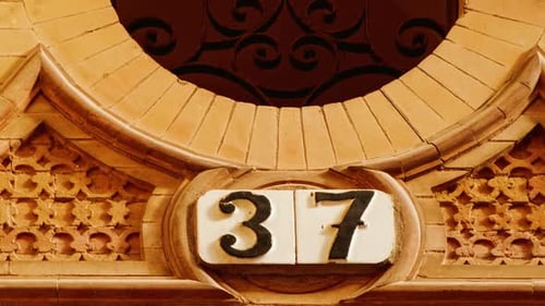 Number 37 (thirty-seven) Affixed to a Building