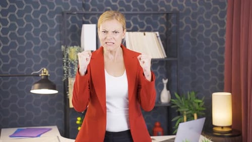 Angry Woman Gesturing and Yelling in Office