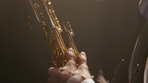 Inspired Elegant Male Saxophonist Performing Solo