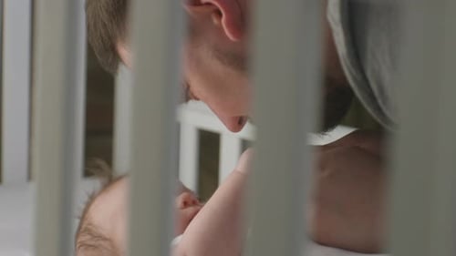 Close Up Shot of Happy Father Plays with Baby