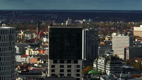 Orbit Shot Around Top of Modern High Rise Hotel or Office Buildings