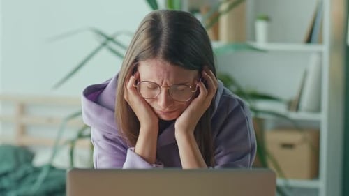 Anxious Sad Woman Looking at Laptop Feeling Frustrated of Bad News