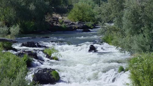 Whitewater rapids explode with summer energy on the rouge river Oregon USA