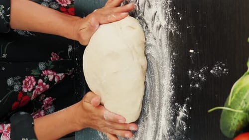 Female making pizza