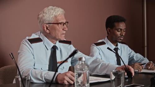 Two Men in Uniform Speak at Conference