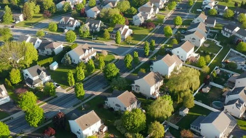 Aerial view of residential houses in spring. American neighborhood housing development, suburb. Real