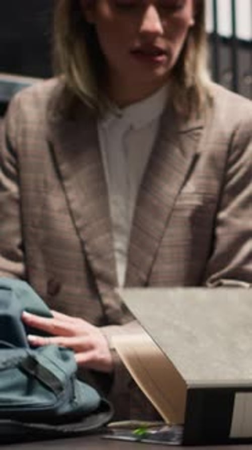 Attorneys Reviewing Documents in a Dark Office