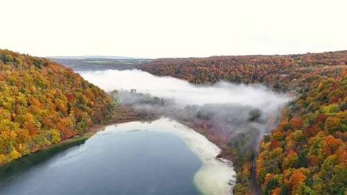 Breathtaking Aerial View Of Autumn Forest Reflected In Calm Lake