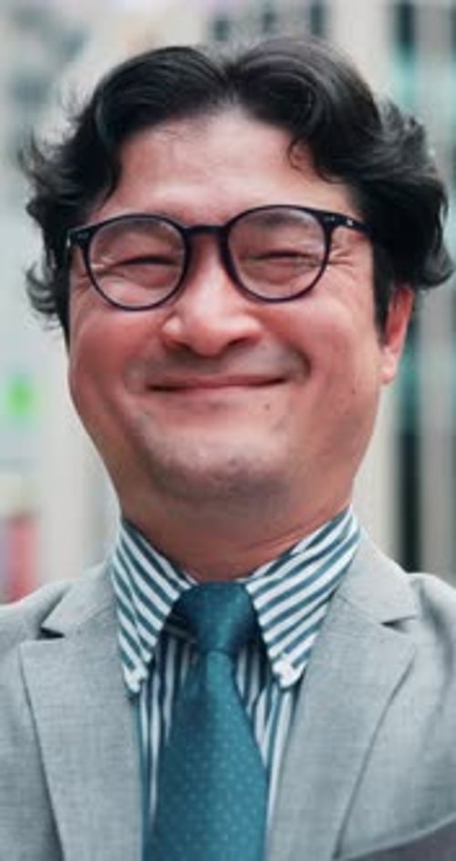 Face, glasses and happy Asian businessman with pride, career experience and corporate job outdoor