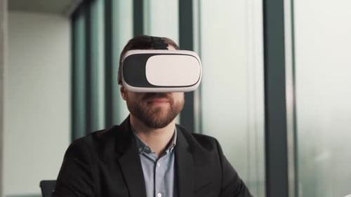 Man Wearing Virtual Reality Headset in Office