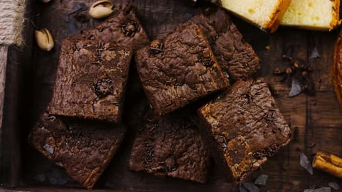 Different Kinds of Cakes Arranged on a Wooden Tray