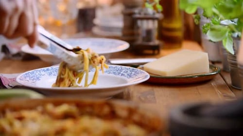 Serving Pasta Dish on Rustic Wooden Table