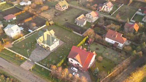 Aerial Landscape of Small Town or Village with Rows of Residential Homes and Green Trees