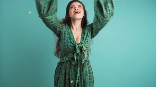 Woman Throws Confetti in Celebration