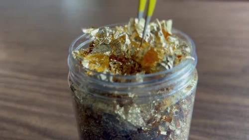 Gold flakes used for face painting and cooking, 24 karat yellow gold