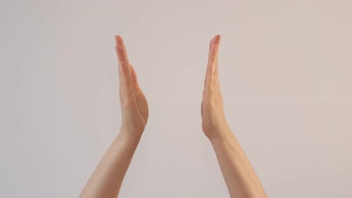 Woman's Clapping Her Hands on White Background and Waving Saying Greeting Goodbye Making Hand