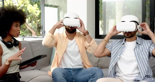Friends Experiencing Immersive Virtual Reality Together Indoors