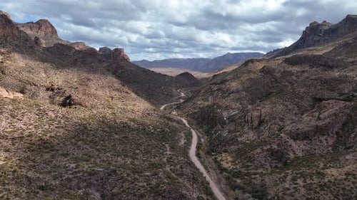 Aerial view of desert landscape with winding road, United States.