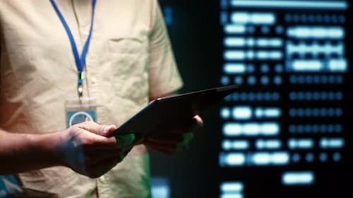 Close Up of Adult Using Tablet at Work