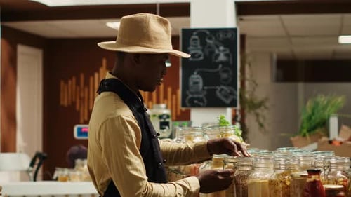 African American Seller Preparing Local Farmers Market Products