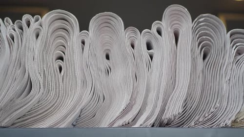 Close Up of Stacked Newspapers