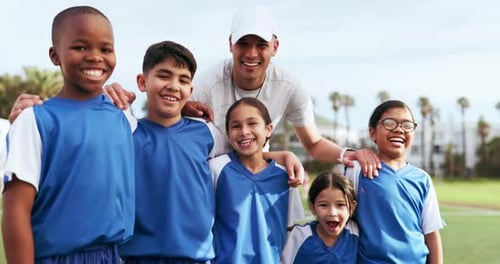 Smiling Children Posing on Soccer Team with Coach