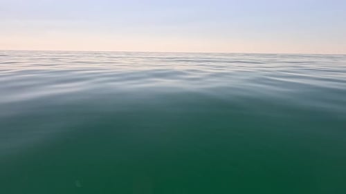 Sea Water Surface Low Angle View Over Clear Azure Sea Water Sun Glare Abstract Nautical Summer Ocean