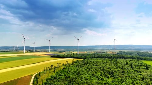 Wind farms set in the countryside produce green energy.