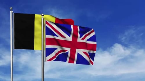 Belgian and United Kingdom Flags Waving in Wind
