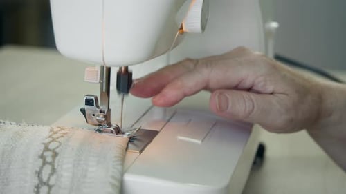 Close Up of Sewing Machine Stitching Fabric