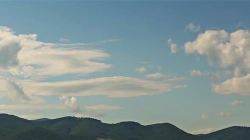 Late afternoon sunlight and Clouds over the hills 4k time-lapse