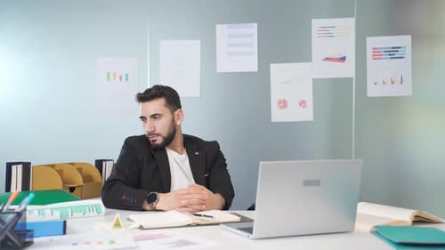 Bored businessman in his office is tense