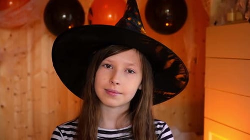 Smiling Girl in Witch Costume for Halloween Party