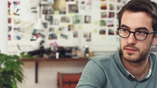 Adults Meet Around a Conference Table in Office