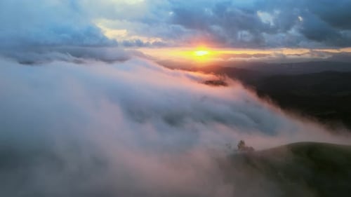 Flying Through Cloud And Mist Above Mountain Valley At Sunset, 4K Aerial Drone