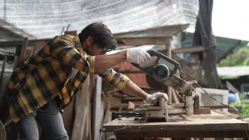 Carpenter make furniture at workshop.