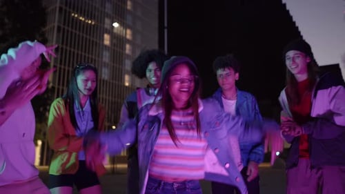 Trendy Group of Young Teenagers Dancing in a Street Party Outdoors in the City Friends Having Fun